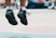 An action shot of a young athlete mid-jump, with intense focus and motion blur.