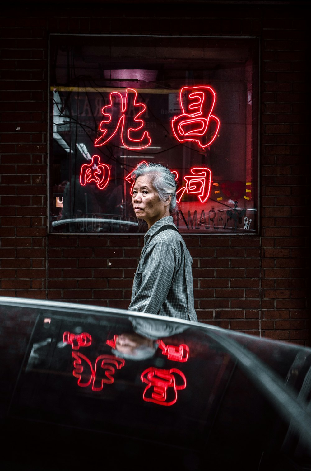 woman standing in front of glass store