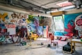 assorted-color painted wall with painting materials