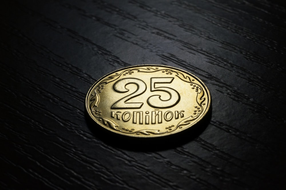 A gold coin that says "25 million."