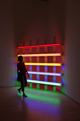 Portrait of Silas Larkin in a dimly lit room with futuristic neon reflections.