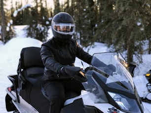 person riding on snowmobile