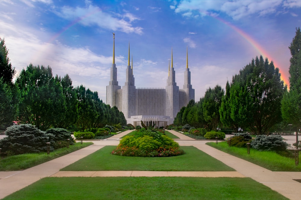 gray concrete building with rainbow illustration