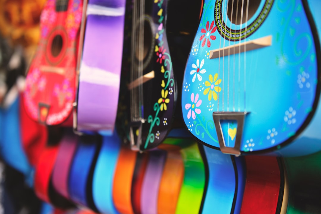 assorted-color guitars