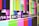 A series of multicolored horizontal and vertical bars are displayed, reminiscent of a television test pattern. Various colors such as green, blue, pink, and yellow are present along with white text containing alphanumeric codes.