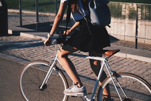 woman riding white rigid bike
