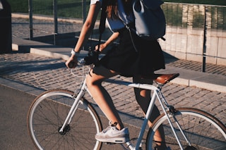 woman riding white rigid bike