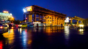 Night shot of a well-lit construction site showcasing structure details.
