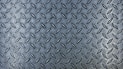 a close up of a metal diamond plate