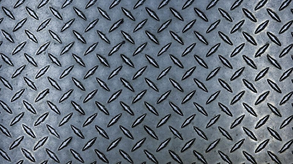 a close up of a metal diamond plate