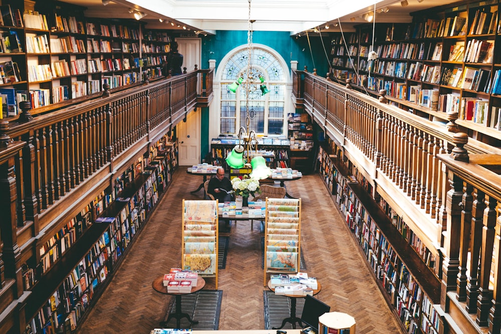 books arranged on shelves inside library