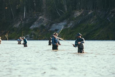 people riding on boat on lake during daytime