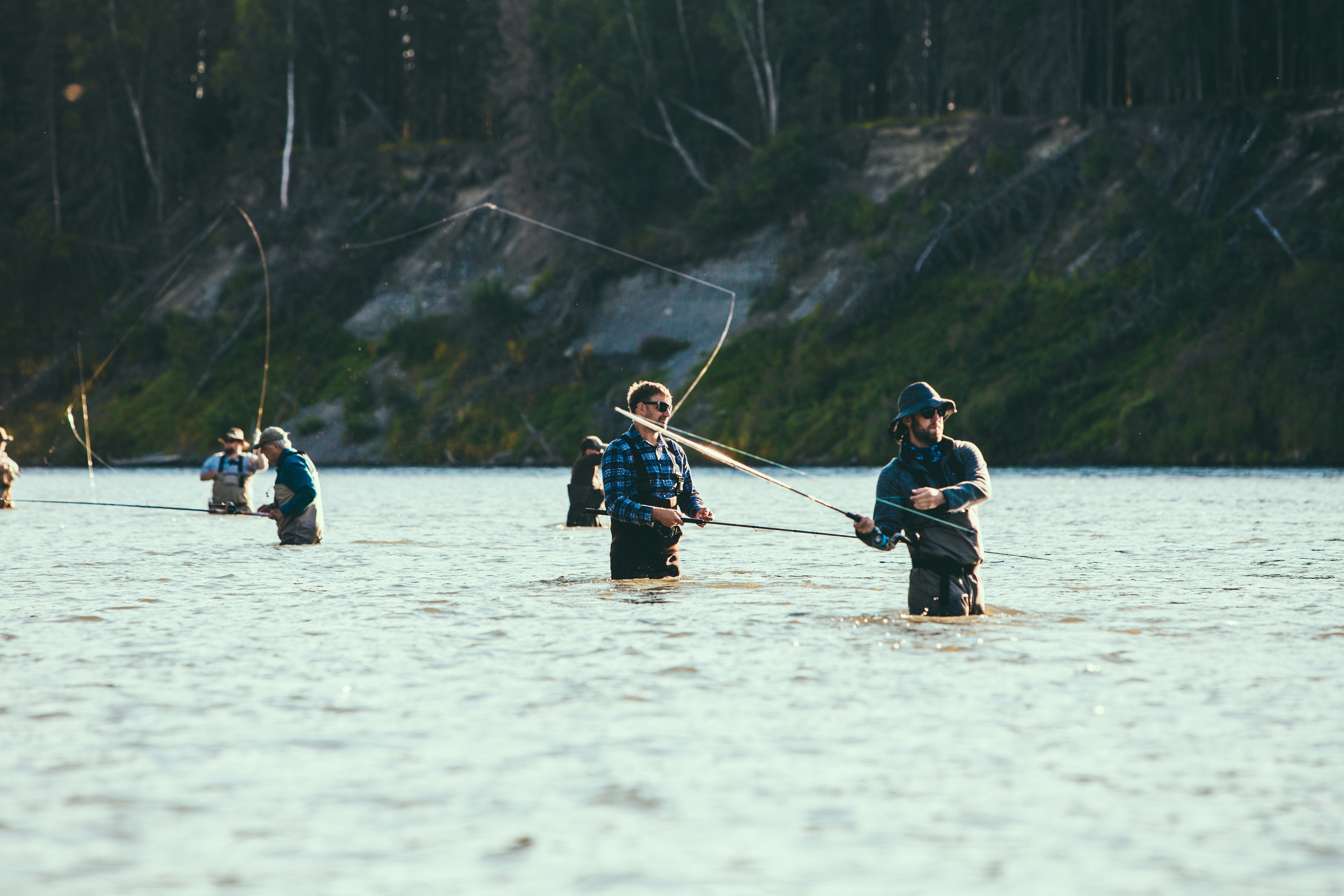 people riding on boat on lake during daytime