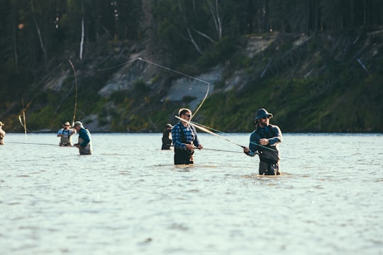 people riding on boat on lake during daytime in Kenai River United States