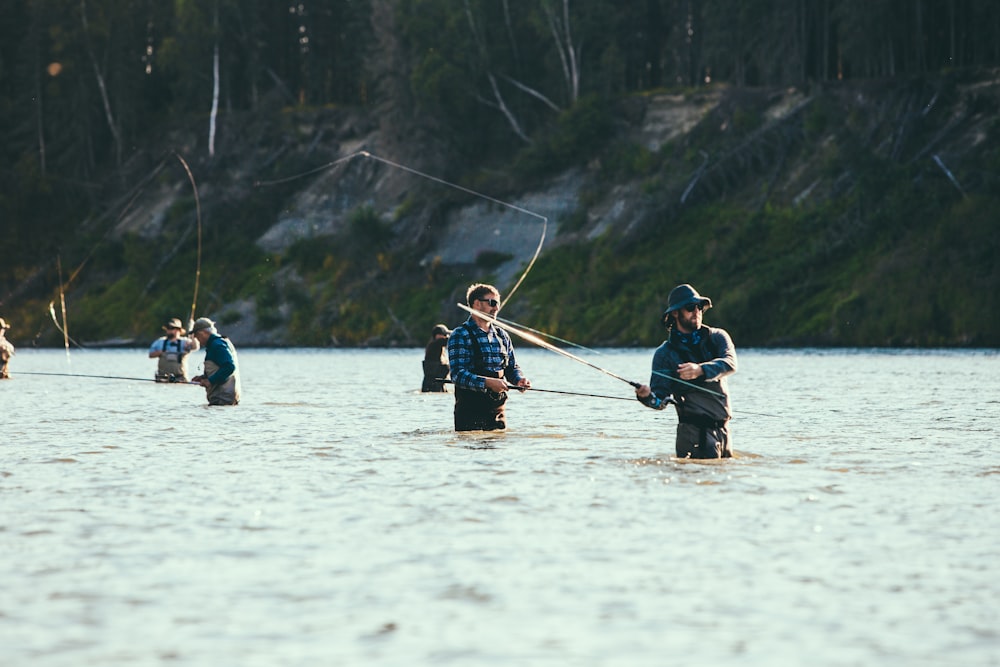 people riding on boat on lake during daytime