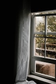 water dew on clear glass sliding window during daytime