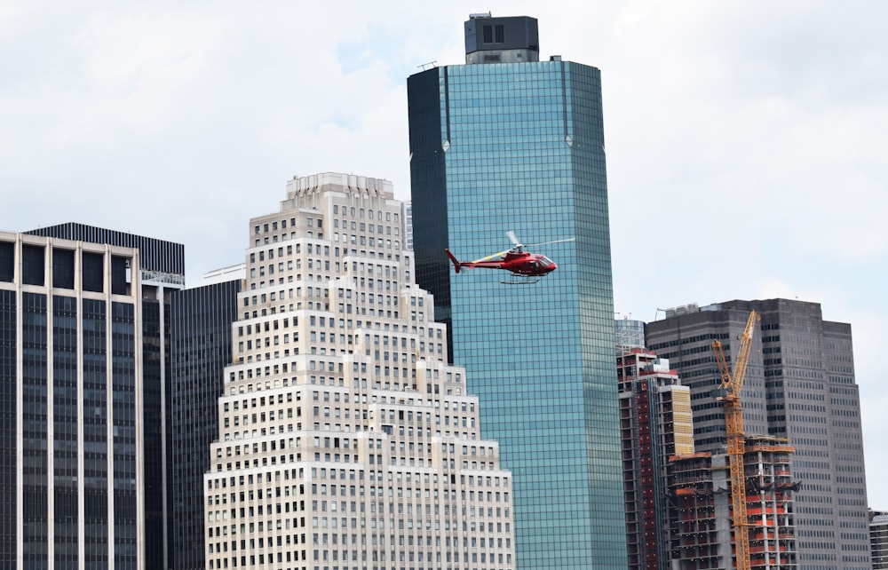 helicopter flying around high-rise buildings