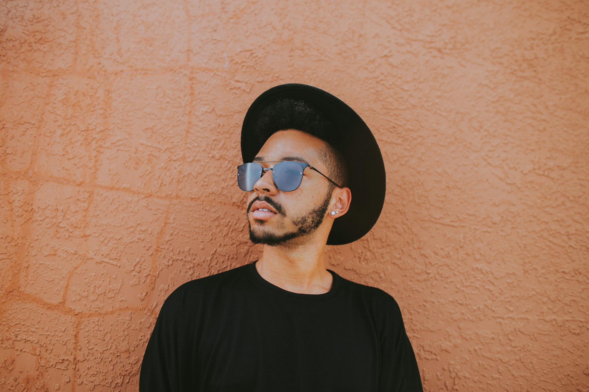 photo of men with sunglasses and black hat