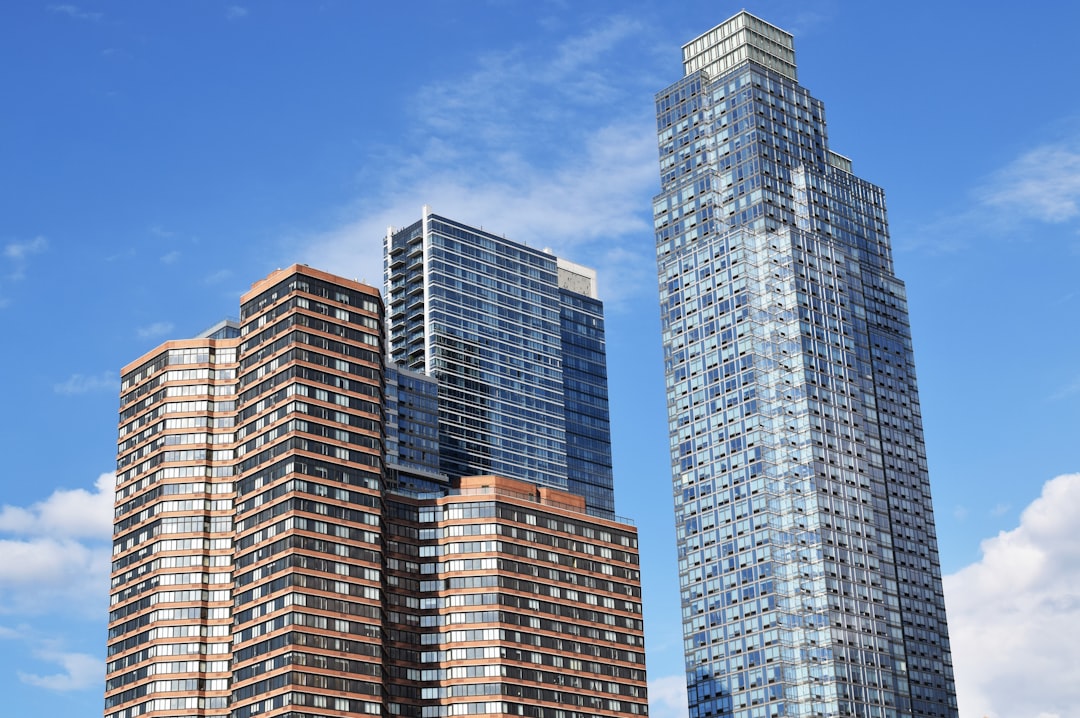 white and blue high rise building under blue sky during daytime