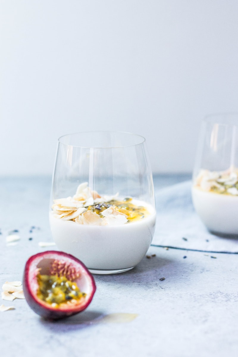 Glass of kefir with grains on a wooden table