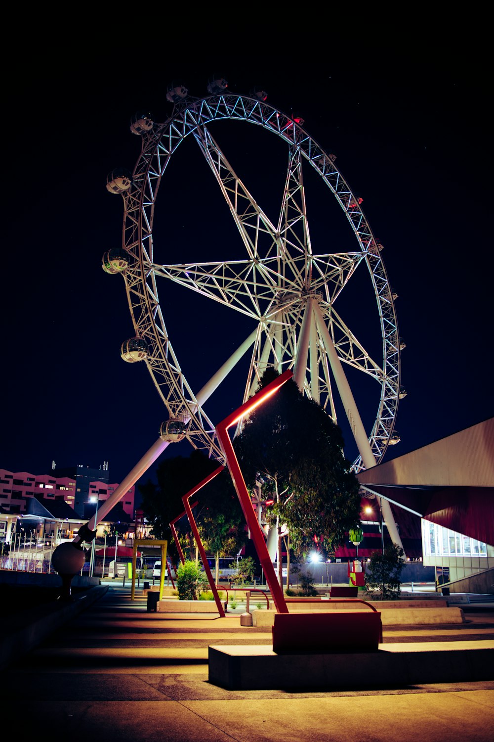 low angle photo of white and red ferris wheel