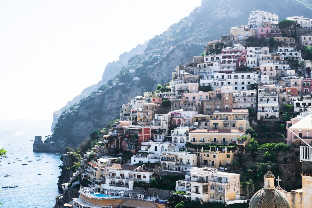 photo of houses near ocean during daytime