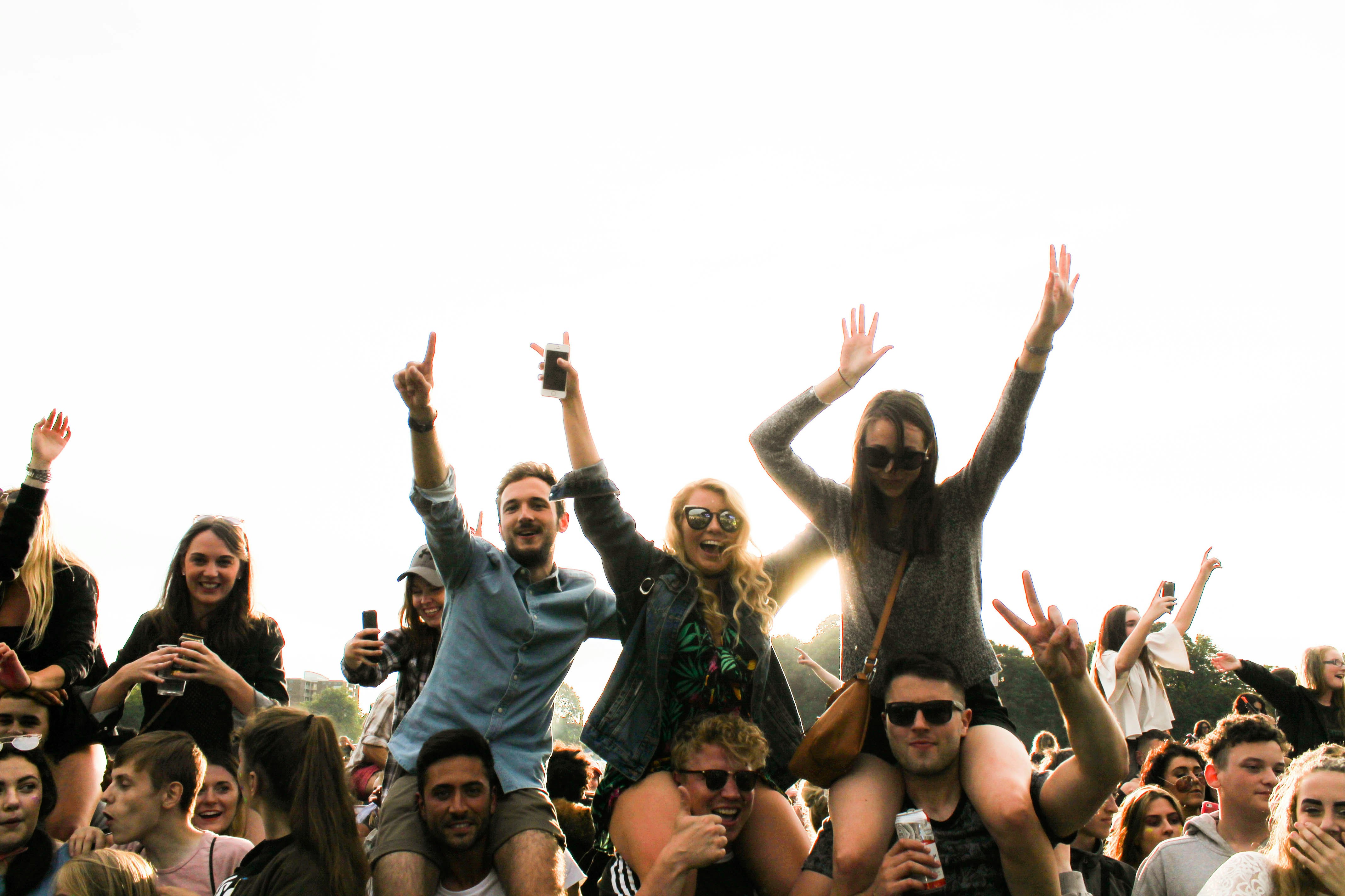 great photo recipe,how to photograph three men carrying women surrounded by many people during daytime