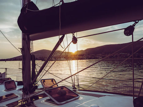 Sunset view from the deck of a local boat with islands in the distance.