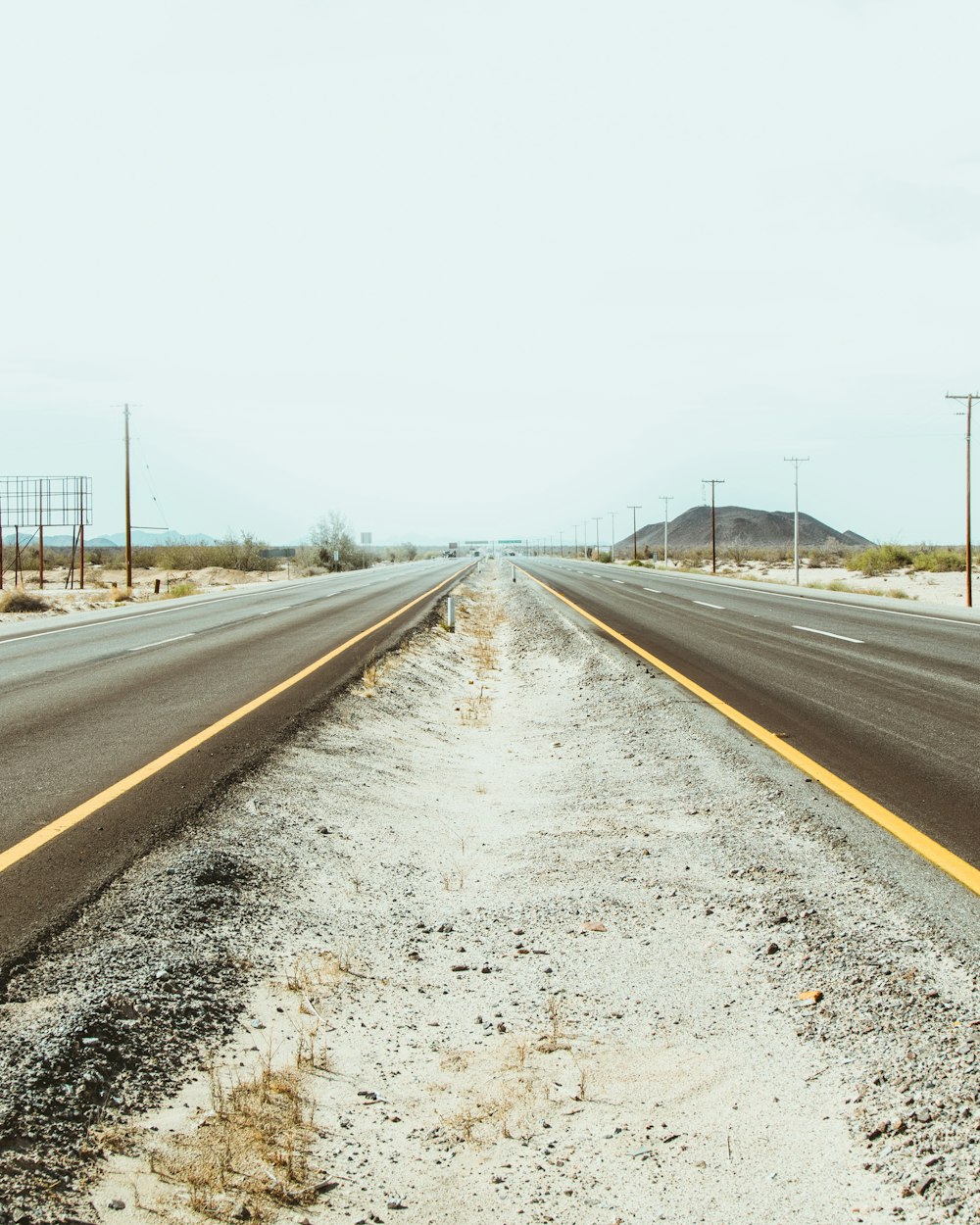 a long empty road with no cars on it