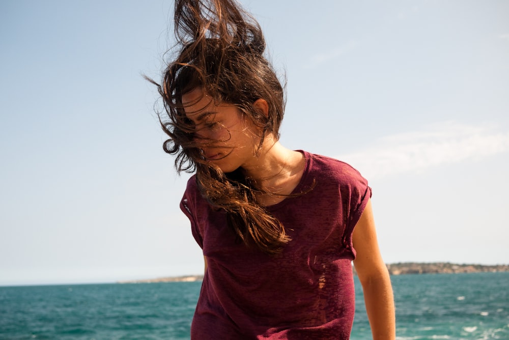 woman standing while her hair is blown