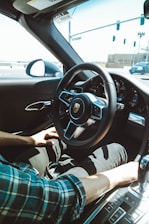 A professional driver using a modern rental car.