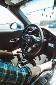 A professional driver using a modern rental car.