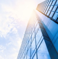 low-angle photo of curtain wall building