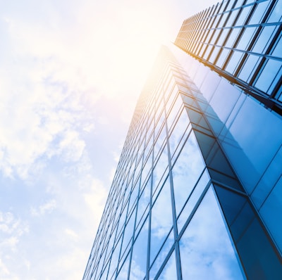 low-angle photo of curtain wall building