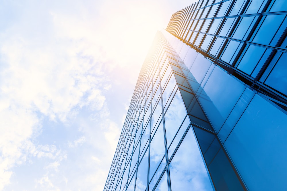 low-angle photo of curtain wall building