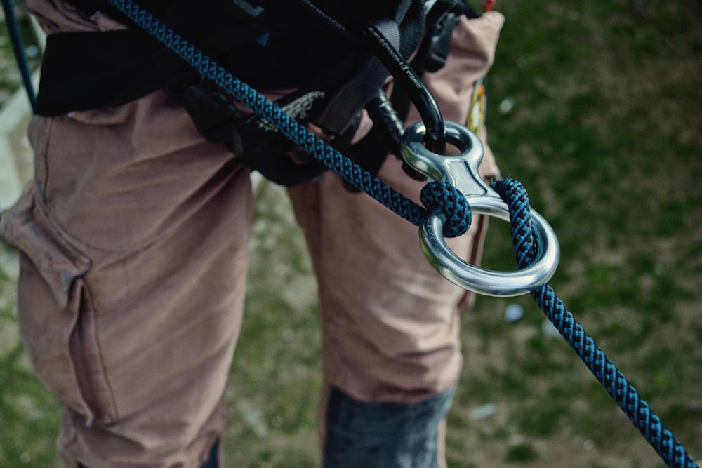 person with blue safety harness on focus photo