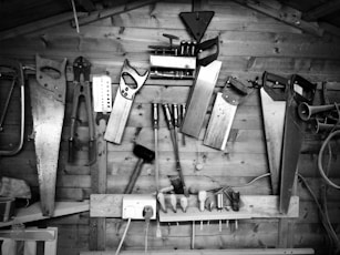 grayscale photography of arranged assorted hand tools
