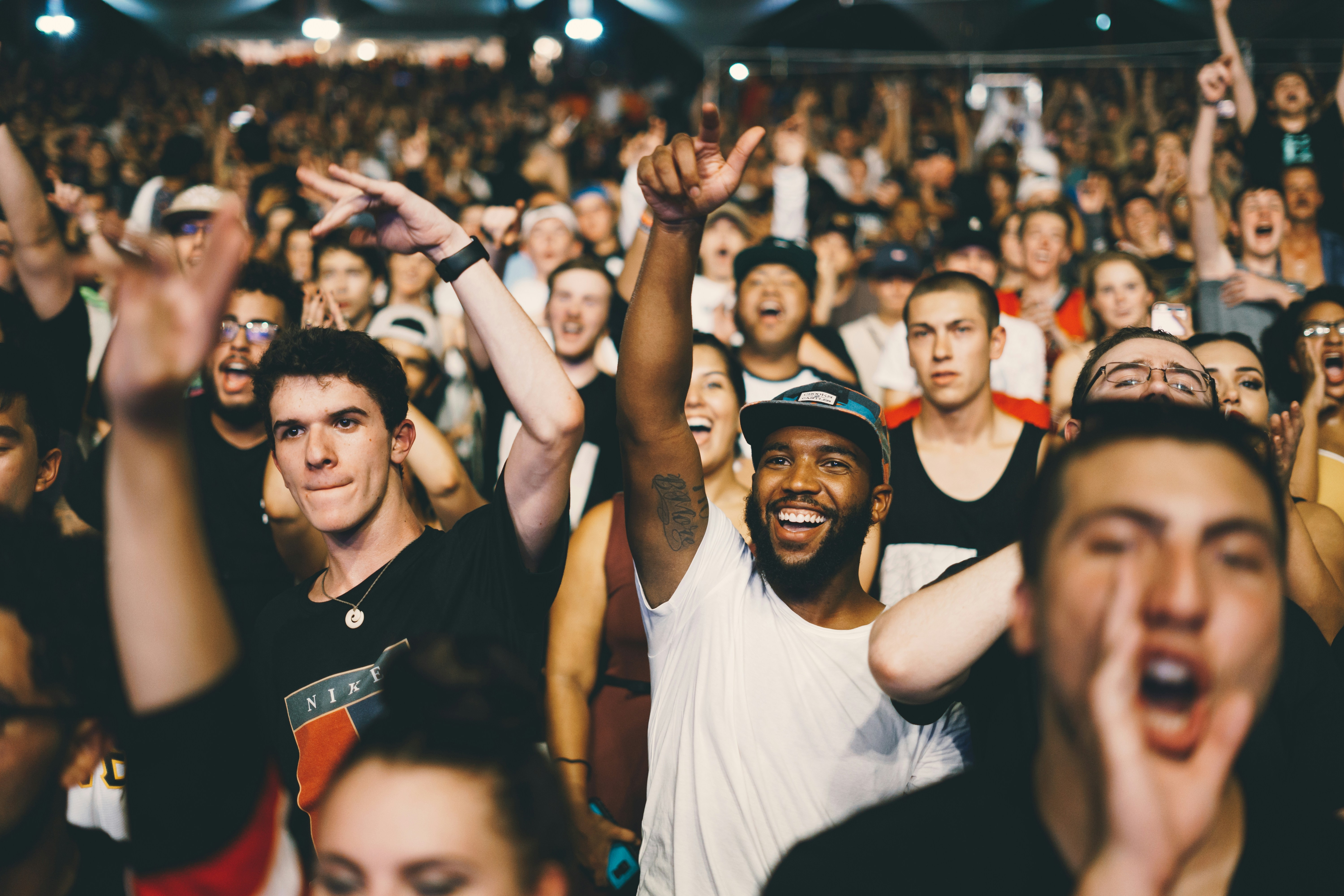 great photo recipe,how to photograph i took this shot to catch the reaction of fans of logic: everybody’s tour expressing how they feel about his lyrical music. this photo means a lot to me because logic is one of my favorite rappers and catching this reaction from the fan reflects on how i was feeling during the concert!; shallow focus photography of man in white shirt