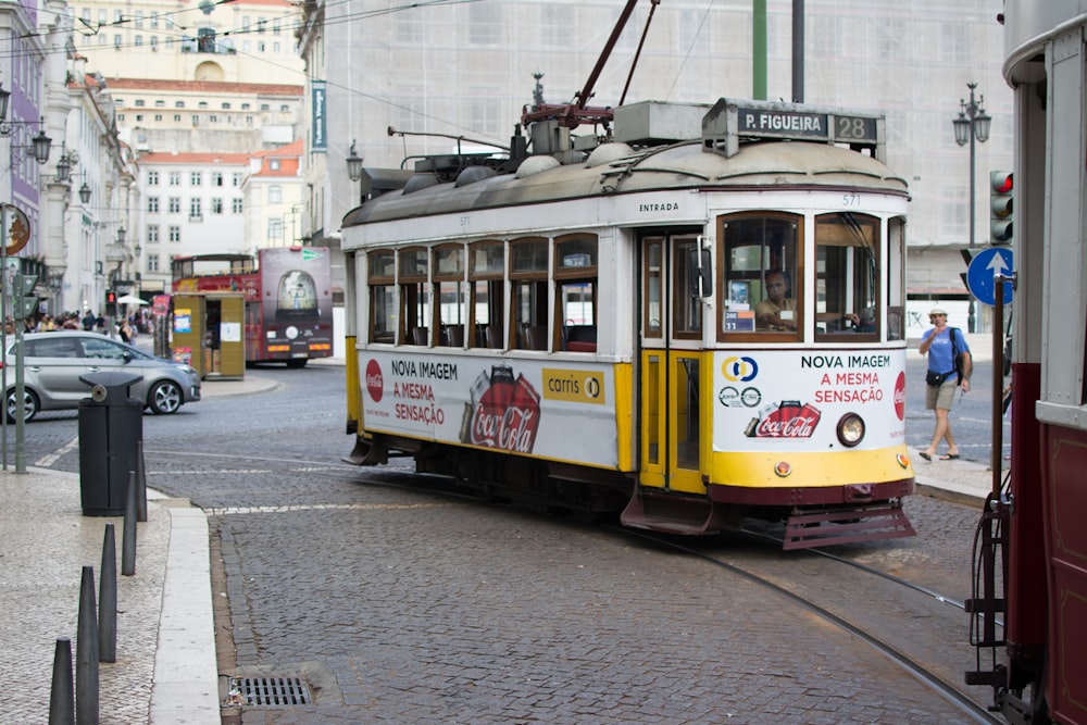 photo of white and yellow tram train