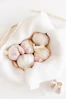 five garlic on white textile
