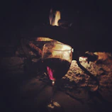 A cozy corner of Ampelos with glasses of red and white wine glowing under warm lighting.