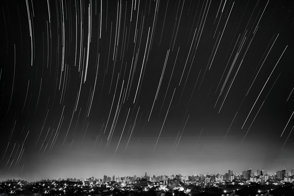 grayscale photo of meteor shower
