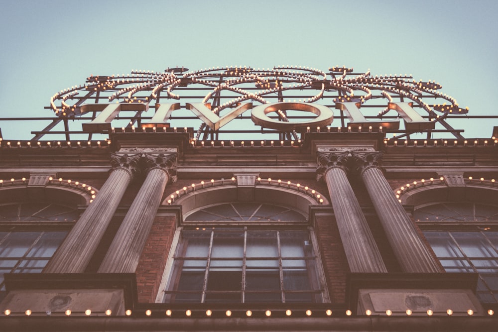 low angle photography of brown concrete building at daytime