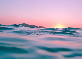 calm body of water during golden hour