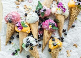 coned ice cream with blueberries and flowers
