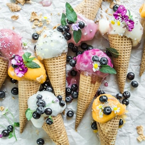 coned ice cream with blueberries and flowers