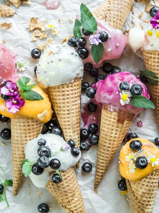 coned ice cream with blueberries and flowers