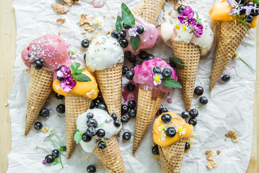 coned ice cream with blueberries and flowers