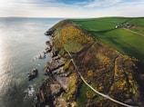 aerial view photography of cliff near body of water