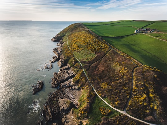 aerial view photography of cliff near body of water in Croyde United Kingdom